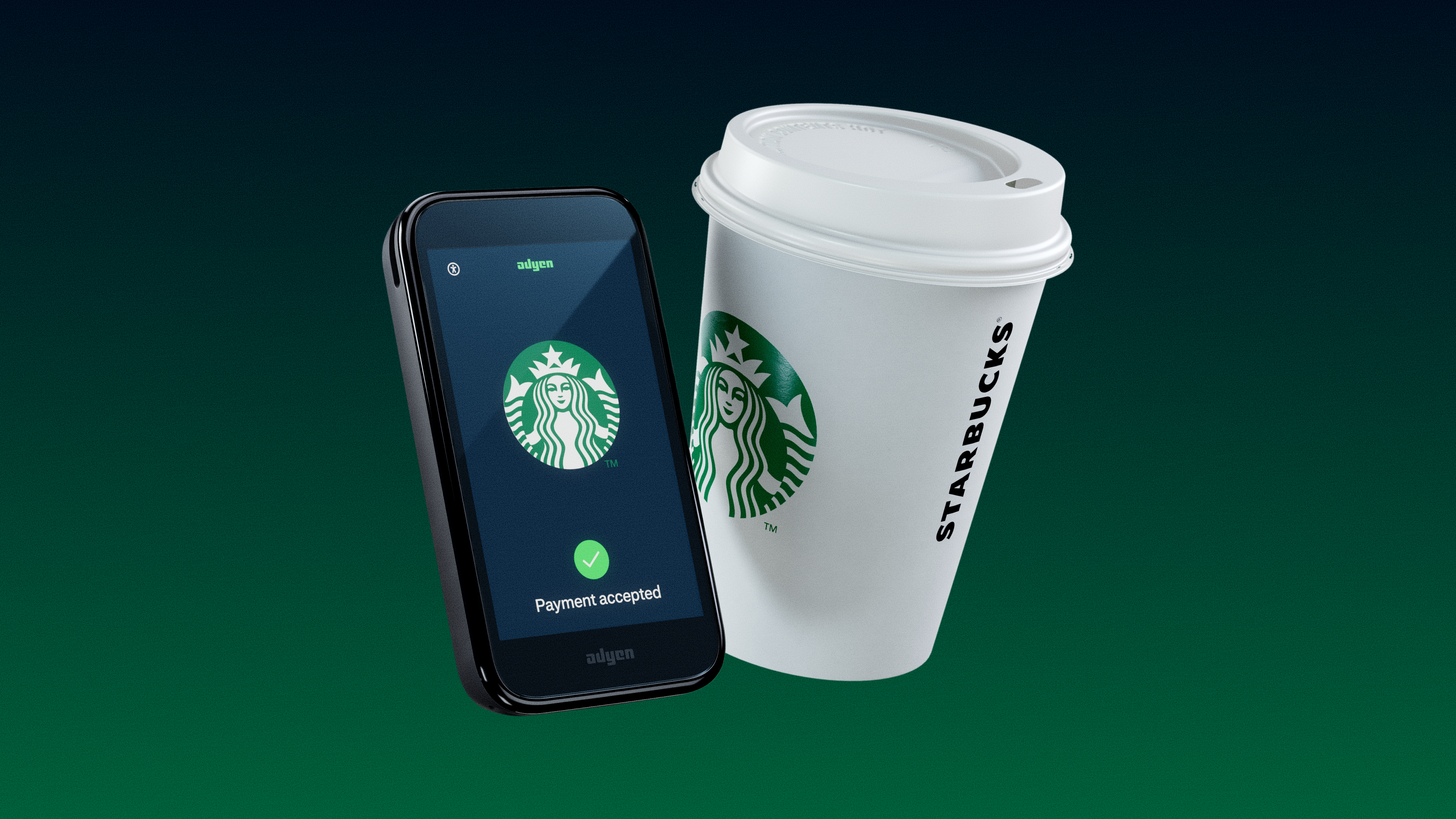 Starbucks take away cup next to Adyen's AMS1 terminal
