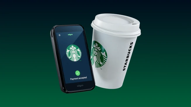 Starbucks take away cup next to Adyen's AMS1 terminal