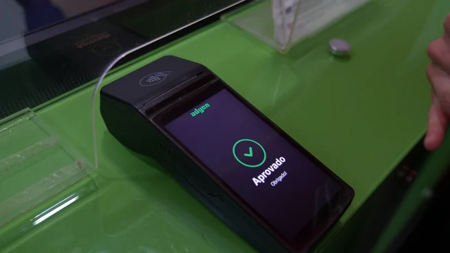 Mobile payment terminal displaying approved transaction in an Adyen setting