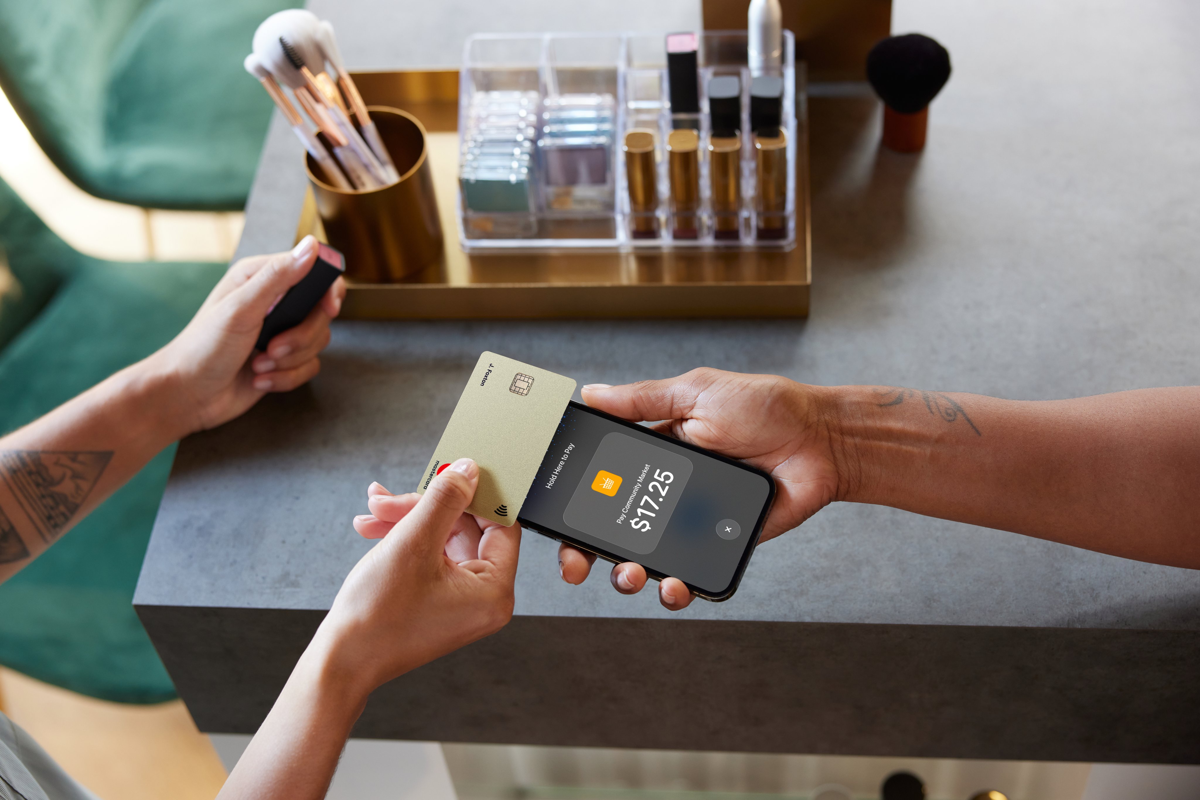 A customer pays with an Adyen card terminal in a modern retail setting.
