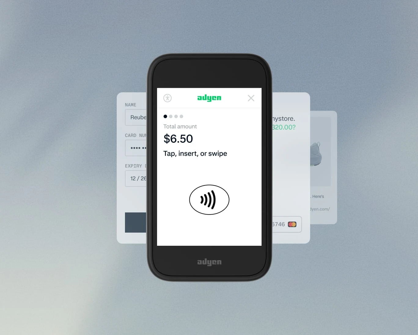 A customer uses an Adyen payment terminal to make a contactless payment, with cards in the background.