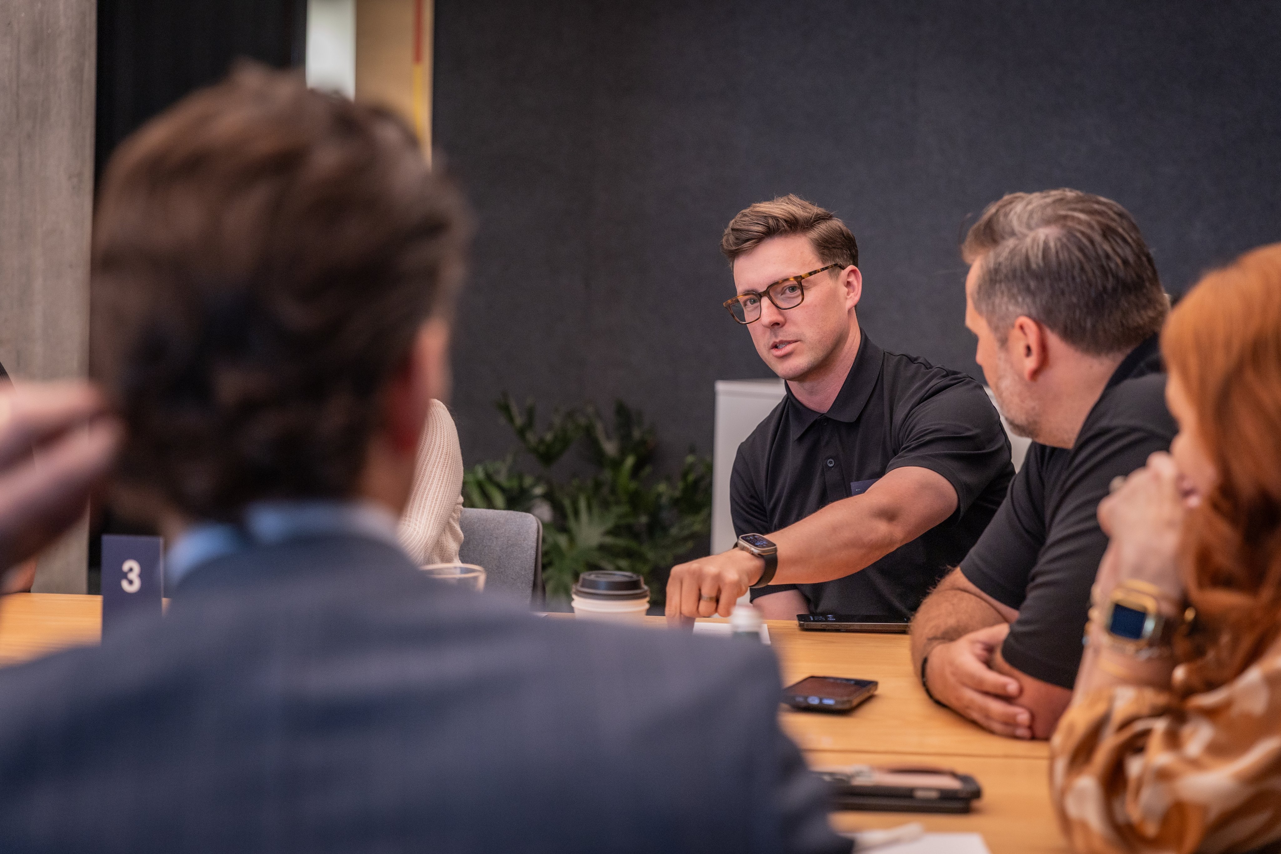 Adyen team members in a meeting discussing payment solutions at the conference table
