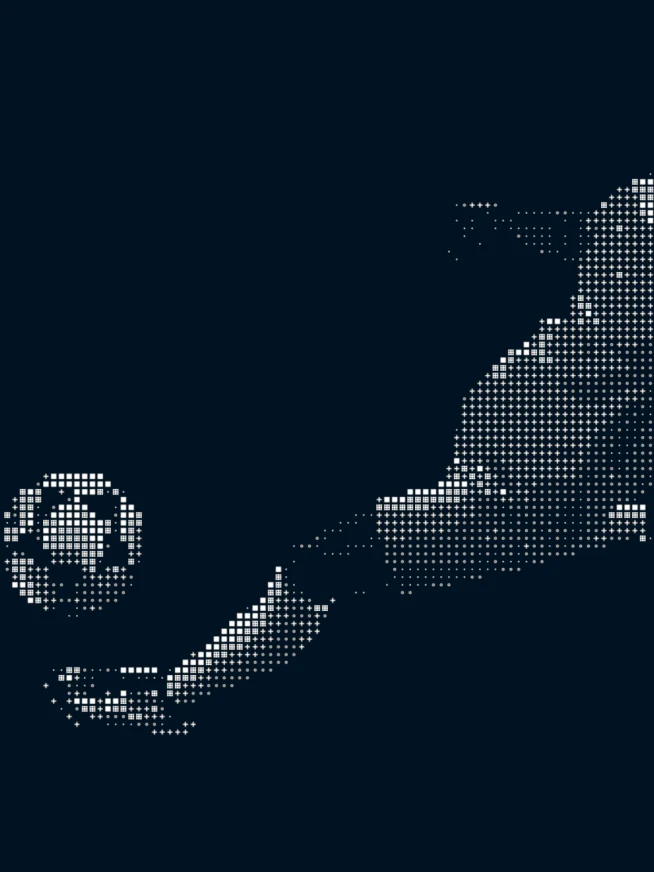A data version of a person kicking a soccer ball in dark mode
