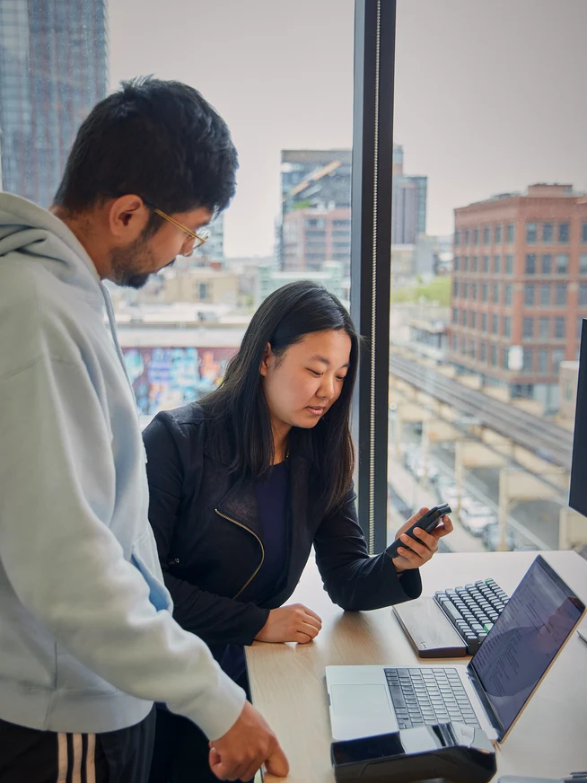 Two colleagues working together in the office