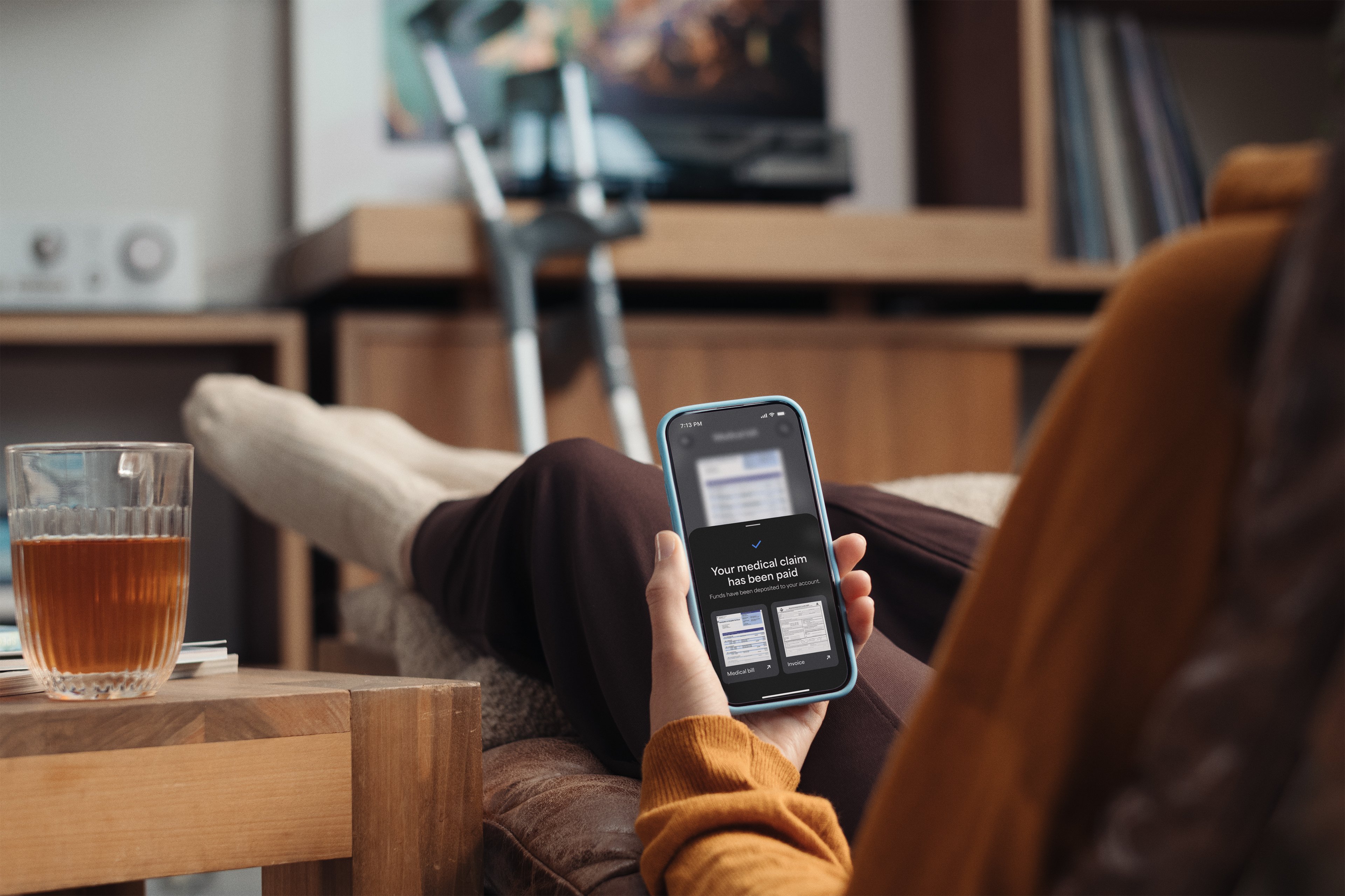 Person with broken leg getting their medical claim on the insurance app