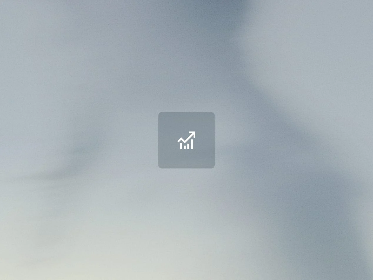Blurry image with a chart icon, possibly indicating growth or analytics, without clear details or context.