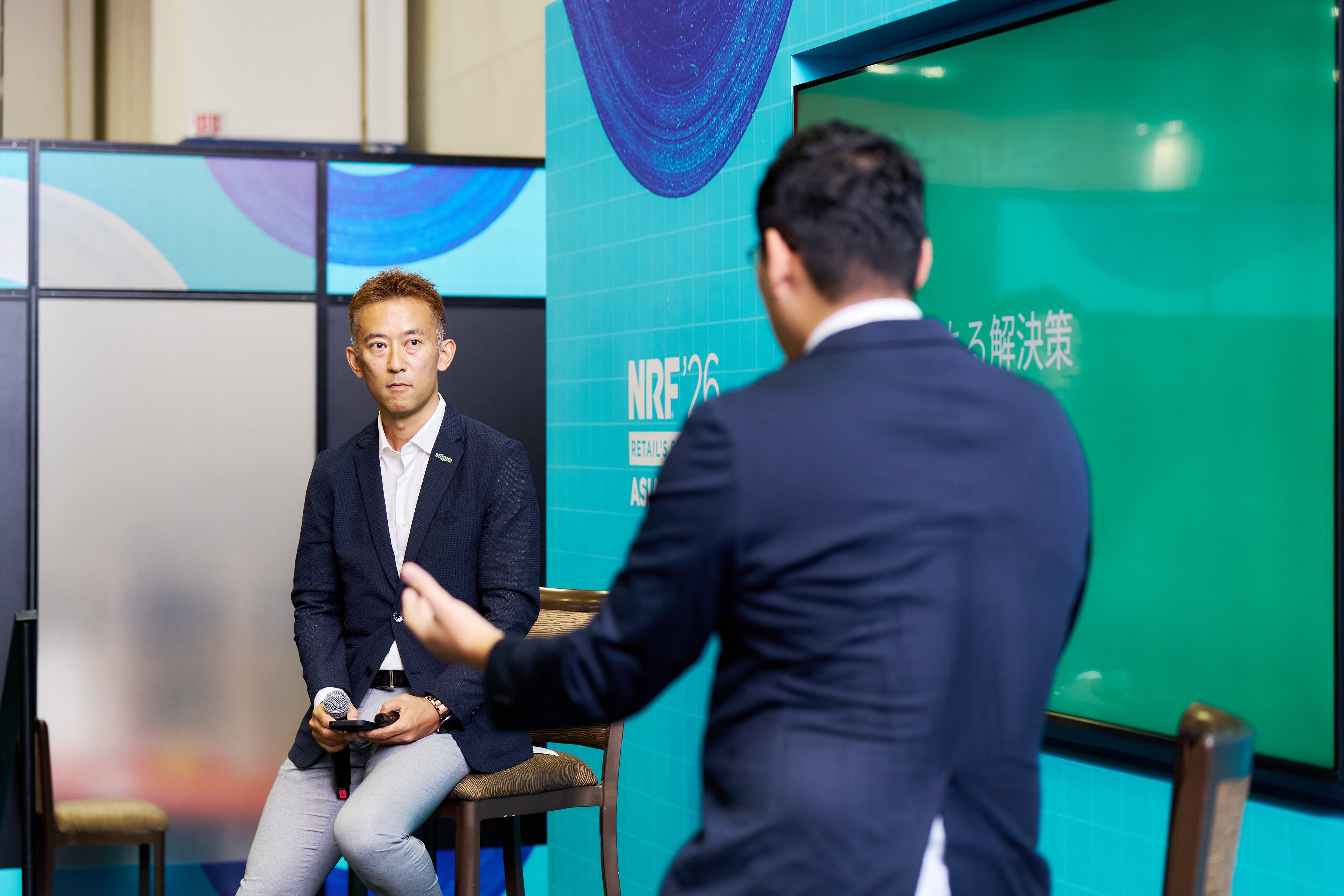 Adyen team member explains payment solutions to a client in the Adyen office.
