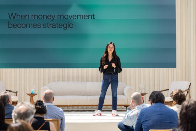 Adyen team member giving a presentation to an audience in a professional setting