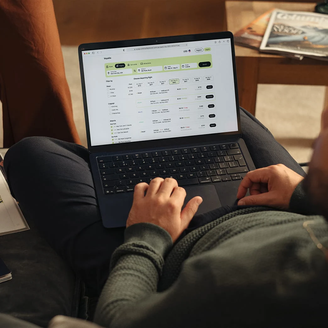 User using a laptop with payment dashboard, likely managing transactions or analysis.