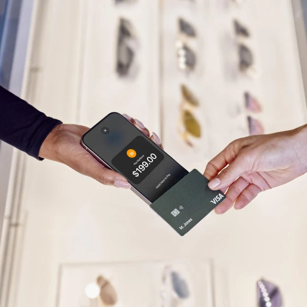 payment with card on iphone tap to pay in a sunglasses store