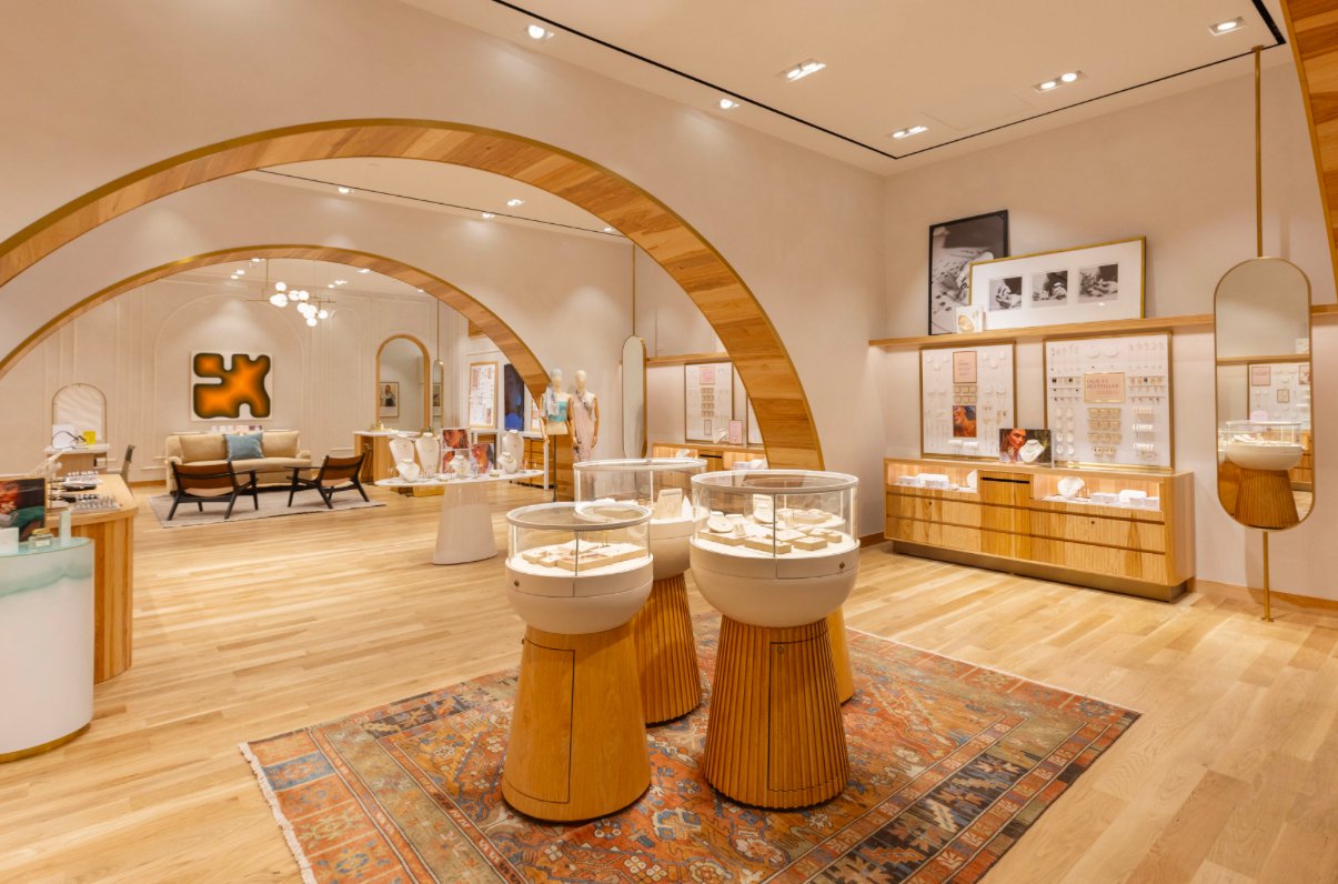 Modern retail interior with wooden accents and display counters, no people visible.
