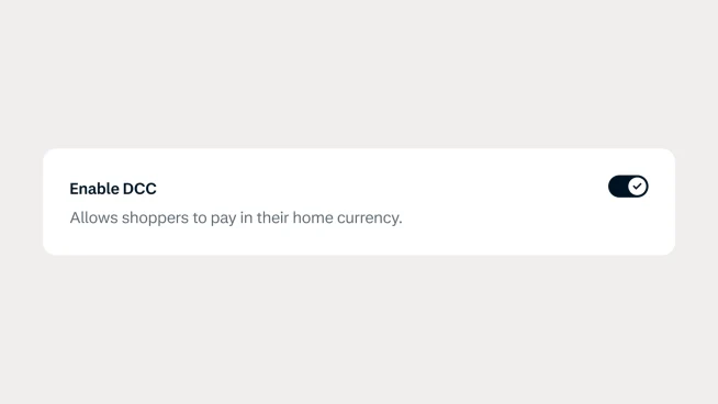 Enable DCC toggle switch on a payment terminal allowing shoppers to pay in their currency.