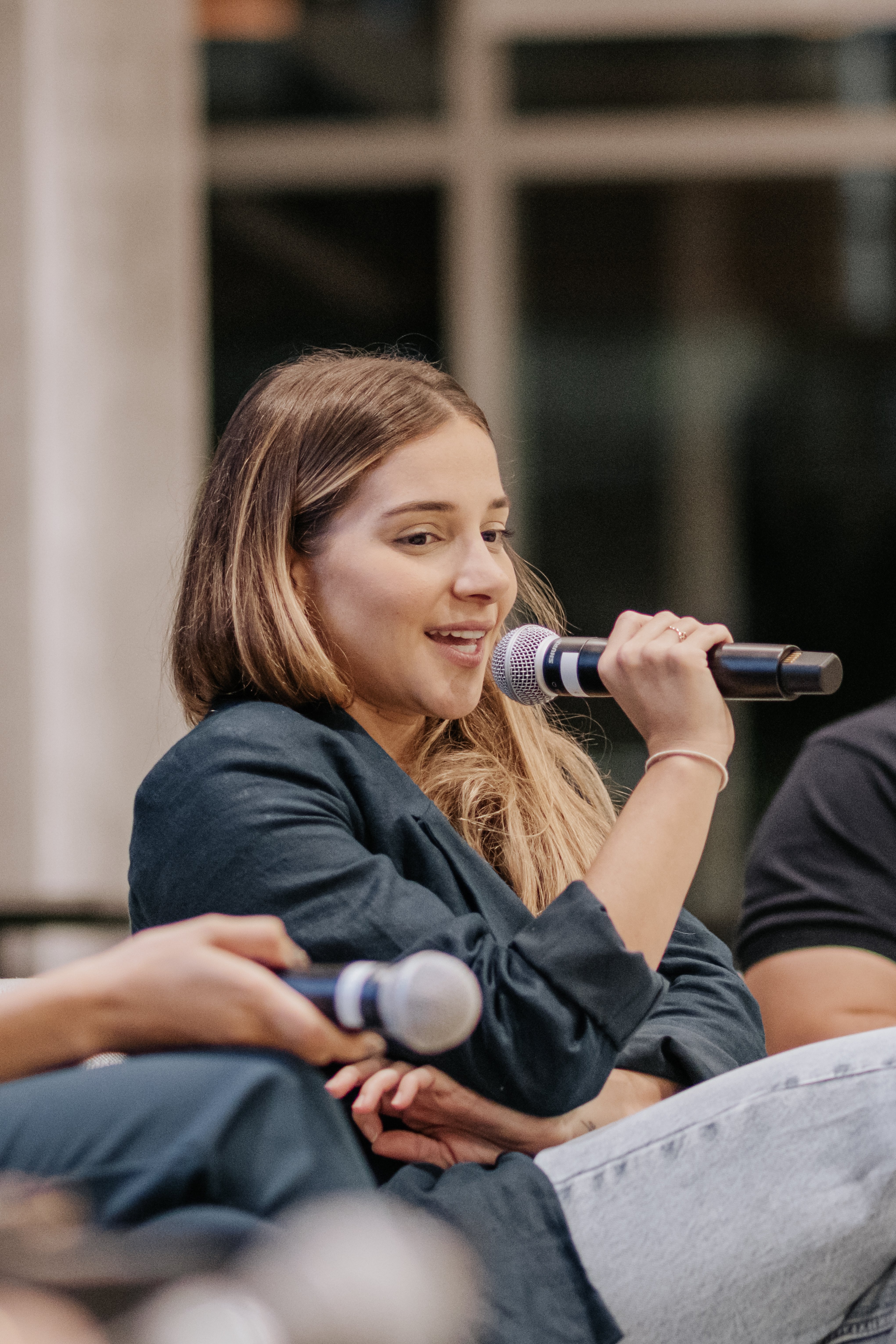 Woman speaking into a mic