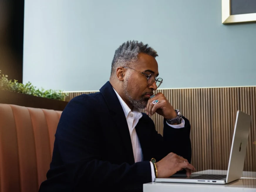 Adyen employee working on a laptop in the office setting