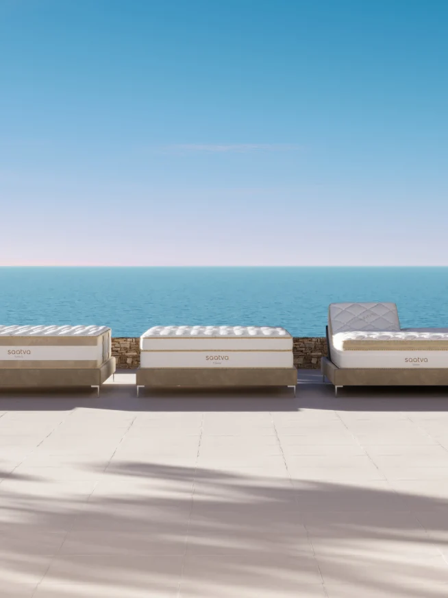 Saatva seaside lounge chairs with ocean view, perfect for relaxing outdoors.