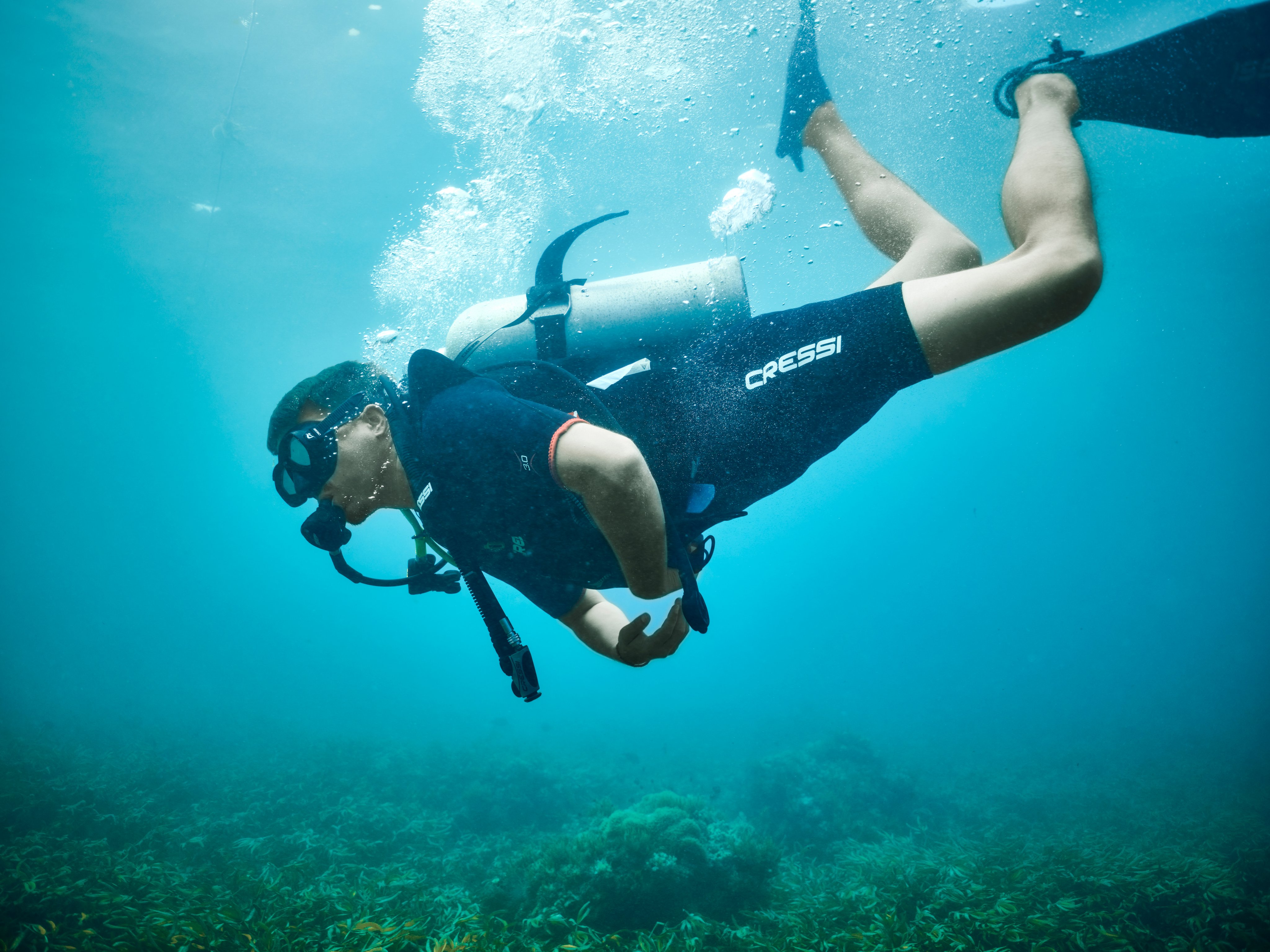 Taucher im klaren Wasser bei Aldiana, Premium Cluburlaub, uncalibrated Bild ohne Farbraum