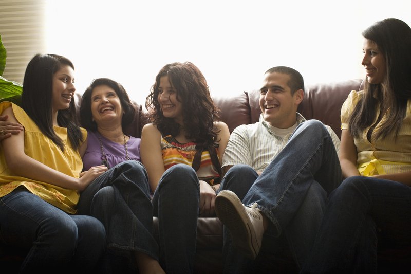 friends-laughing-on-sofa