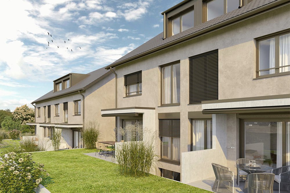 Einfamilienhäuser mit grossen Fenstern und Terrasse, umgeben von Grünflächen am Unterwartweg 8, 4132 Muttenz