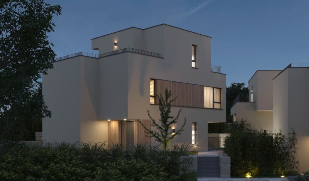 Moderne zweistöckige Villa bei Nacht mit beleuchteten Fenstern und Garten.