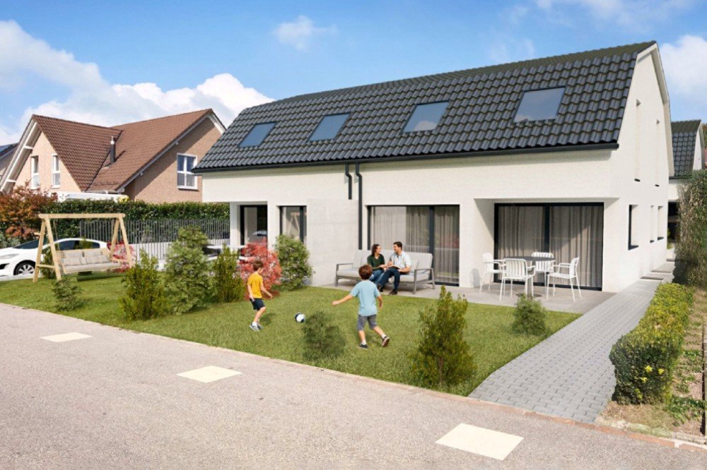 Ein weisses Doppeleinfamilienhaus am Büneweg 8, 4114 Hofstetten-Flüh.