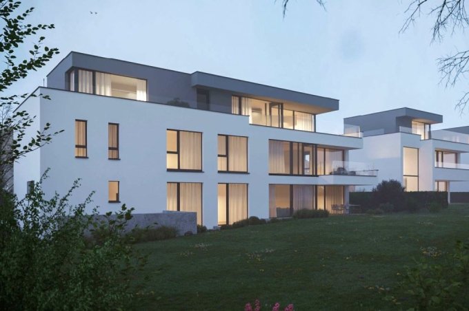 2 weisse Mehrfamilienhäuser mit Eigentumswohnungen an der Rebgasse in Binningen.