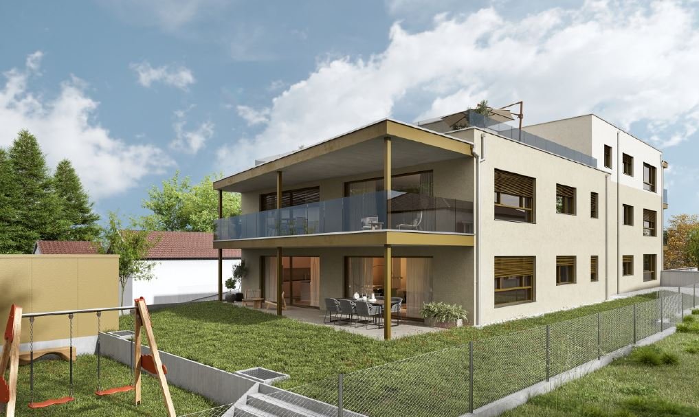 Moderne Wohnanlage mit Balkon, Garten und Spielplatz für Familien im Grünen.