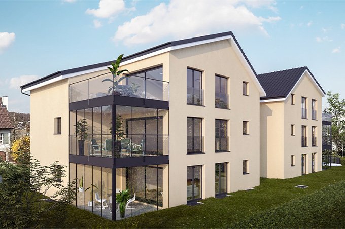 2 Mehrfamilienhäuser mit gelber Fassadenfarbe, Eigentumswohnungen und Balkonen an der Chillmattenstrasse in Biel-Benken.