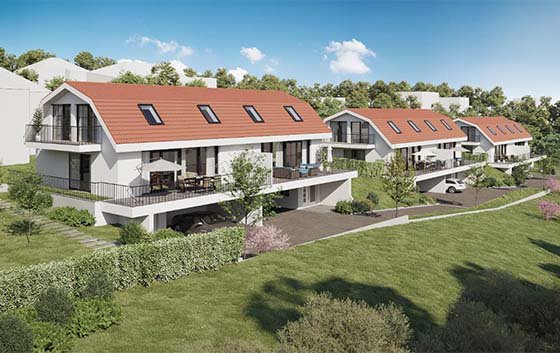 Weisse Doppeleinfamilienhäuser mit Garten, Garage und Balkon am St. Benedikt in Erschwil.