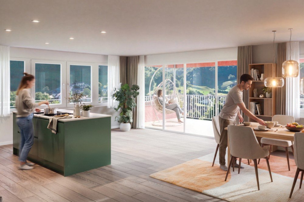 Wohnzimmer mit Balkon, Küche und Esstisch des Mehrfamilienhauses am Breitenweg 22, 4436 Oberdorf.