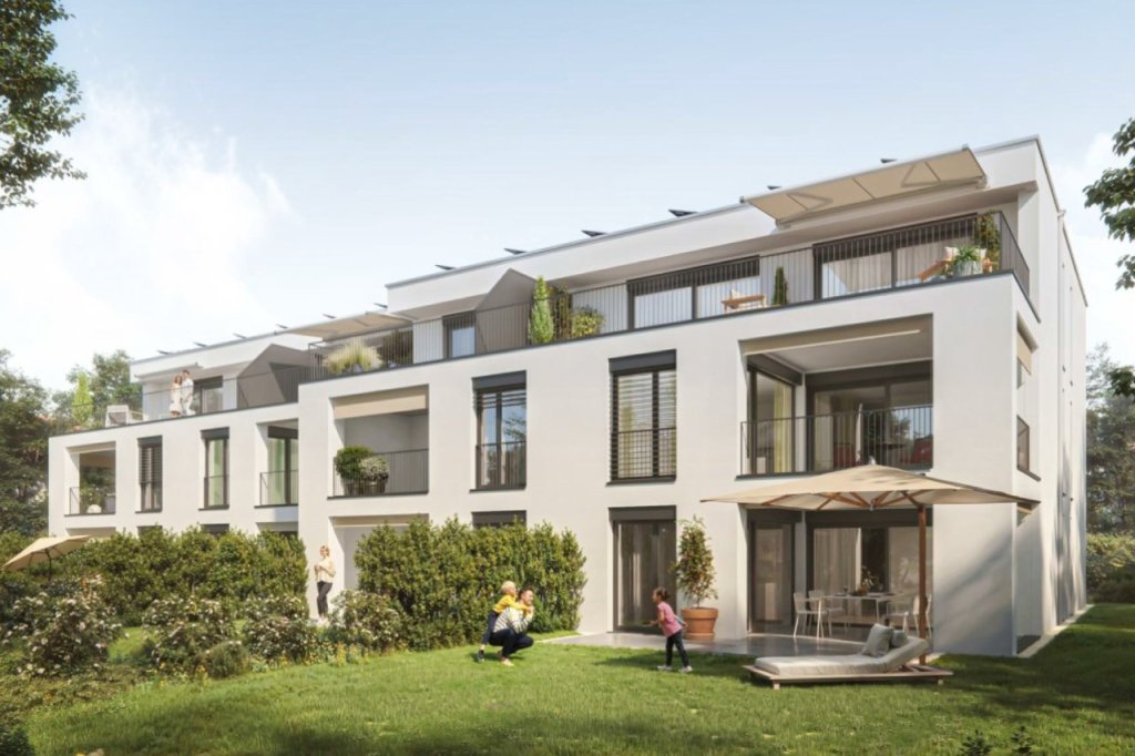 Modernes Wohngebäude mit Balkonen, Grünflächen und Sitzbereichen im Freien an der Eichenstrasse 17, 4142 Münchenstein.