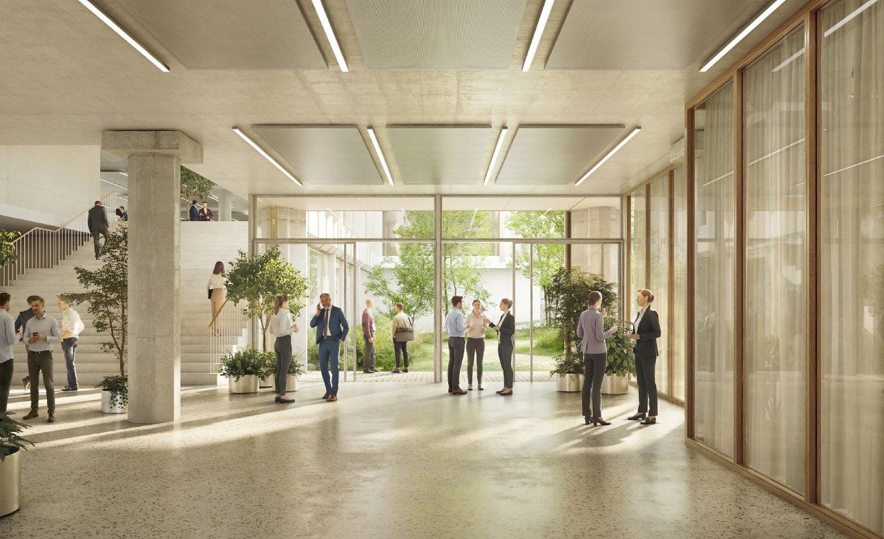 Moderne Banklizenz mit grossen Glasfronten, hellem Raum und Treppen im Hintergrund.