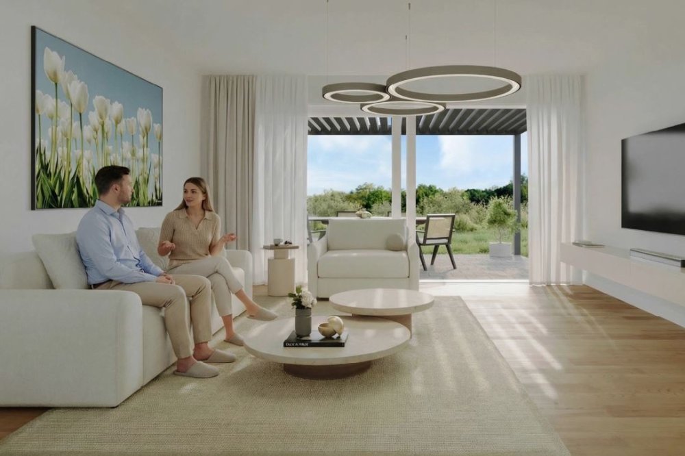 Wohnzimmer der Einfamilienhäuser mit Balkon am Baumgartenweg 57, 4132 Muttenz.