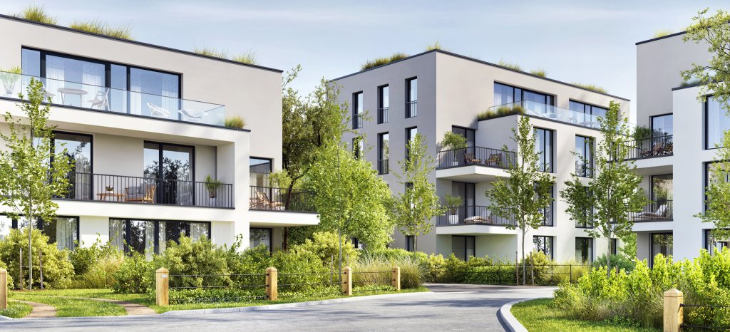 Moderne Wohnanlagen mit begrünten Balkonen in einer naturnahen Umgebung.
