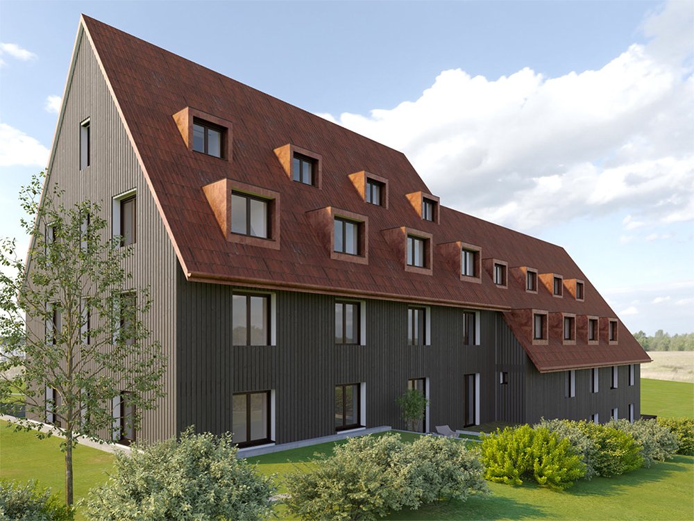 Mehrgeschossiges Haus auf der Rückseite mit roten Dachziegeln, grünen Bäumen und Büschen am Niedermattweg 2a, 4124 Schönenbuch.