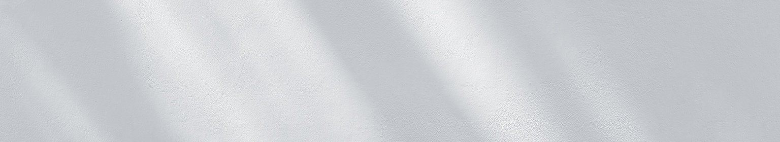 Ein Schatten auf einer weissen Wand.