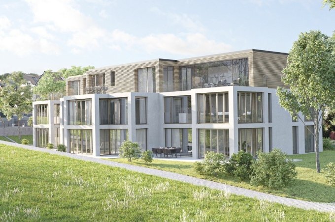 Mehrfamilienhaus mit Eigentumswohnungen und Rasen am Jakobsweg 