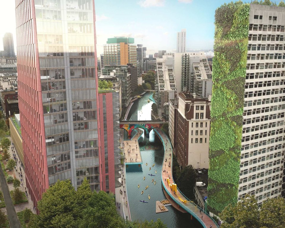 aerial image of manchester high rise buildings, with a long canal running through