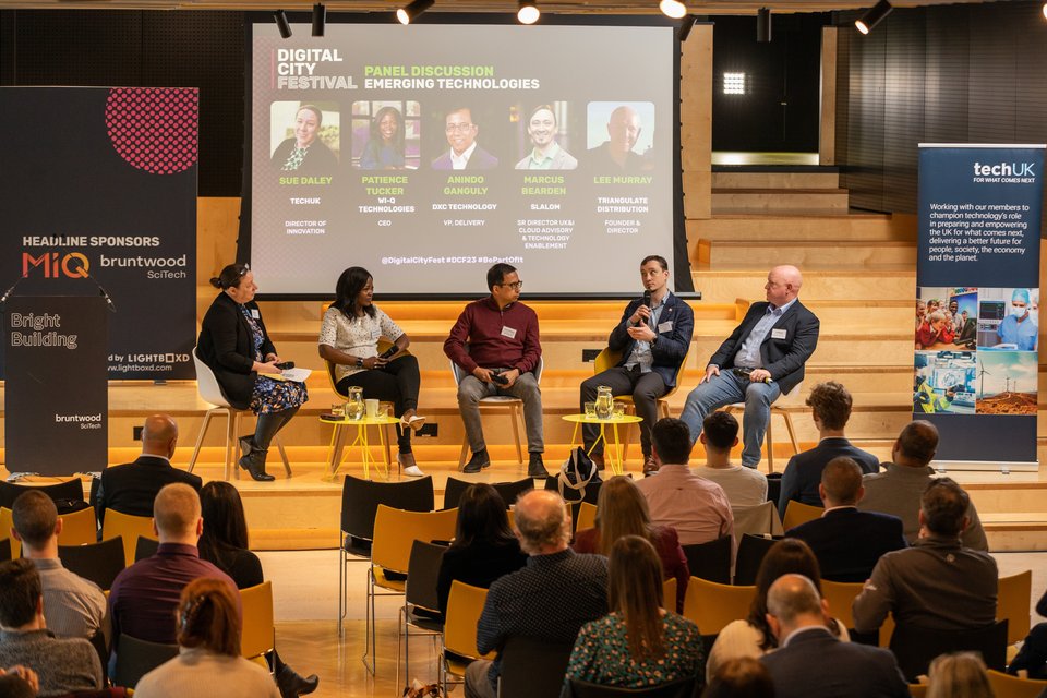 A business event with focus on speakers on stage