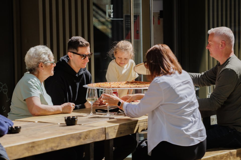 Family dining outside at Circle Square