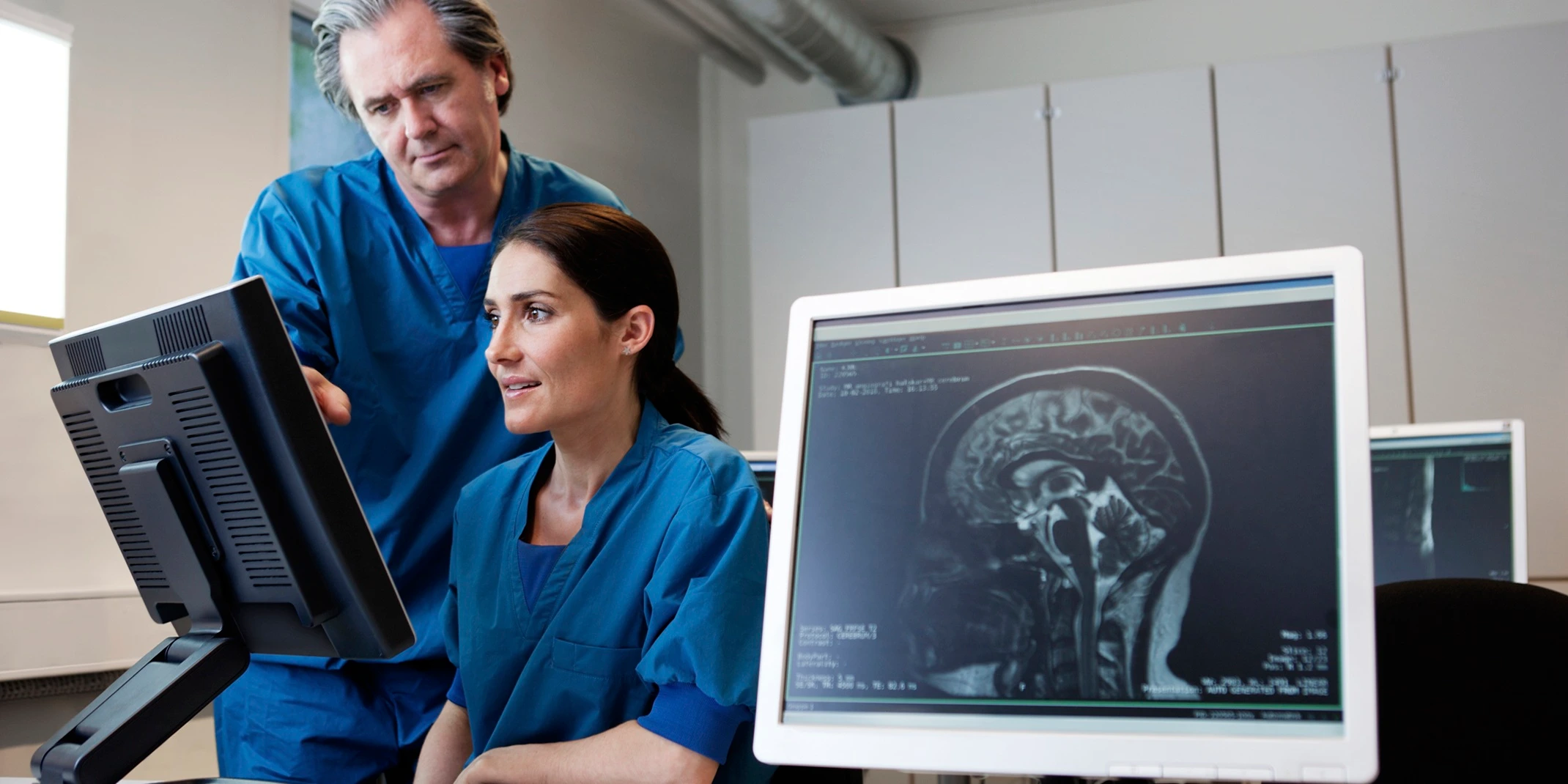 doctor and nurse looking at MR images