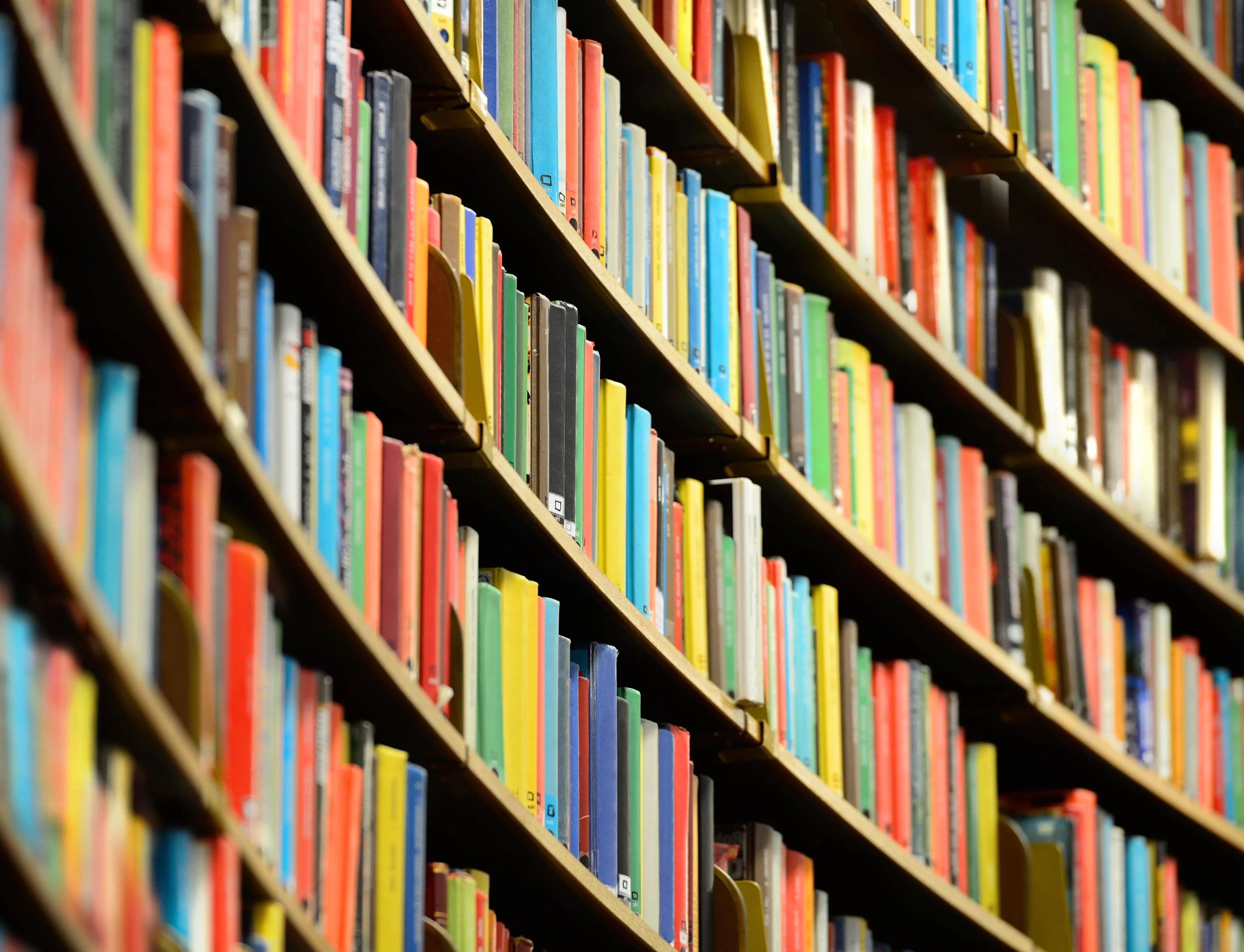 rows of colorful books on bookshelves