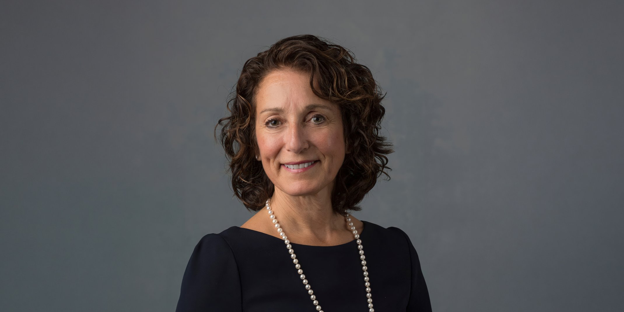 Photo of Dr Susan Margulies, Assistant Director of the National Science Foundation Engineering Directorate, on a decorative background. Photo credit: Emory University