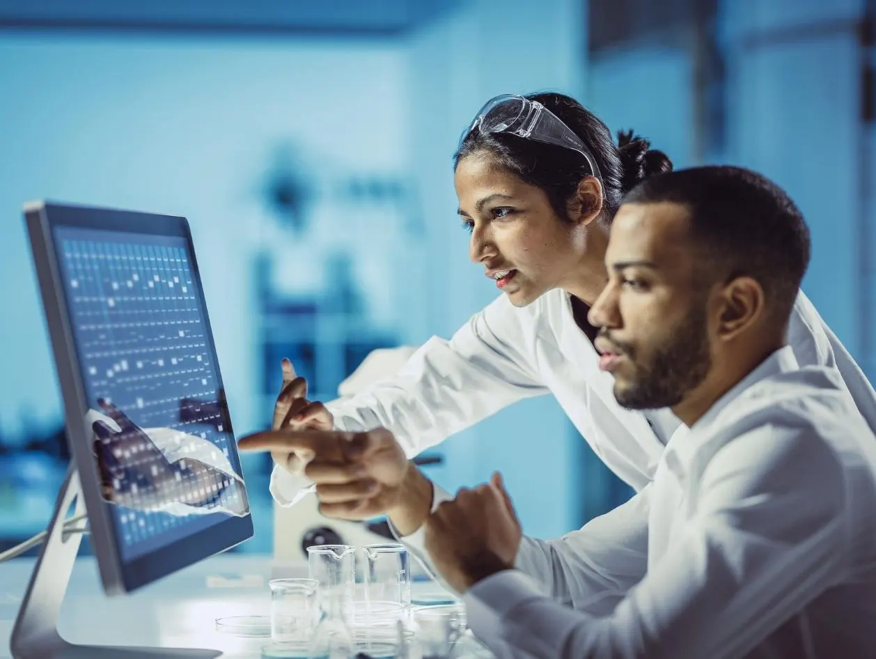 Scientists Working in The Laboratory, Using Touch Screen