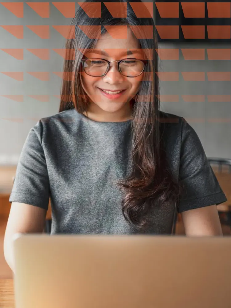 Young business woman using laptop at cafe