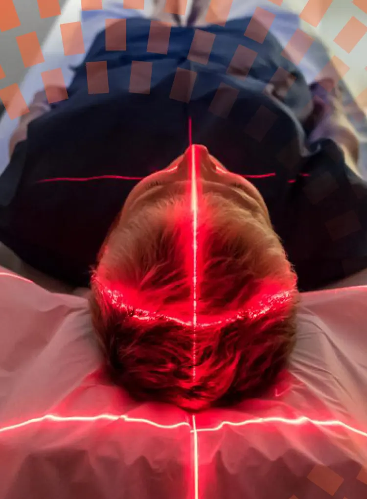 Patient lying inside a medical scanner in hospital