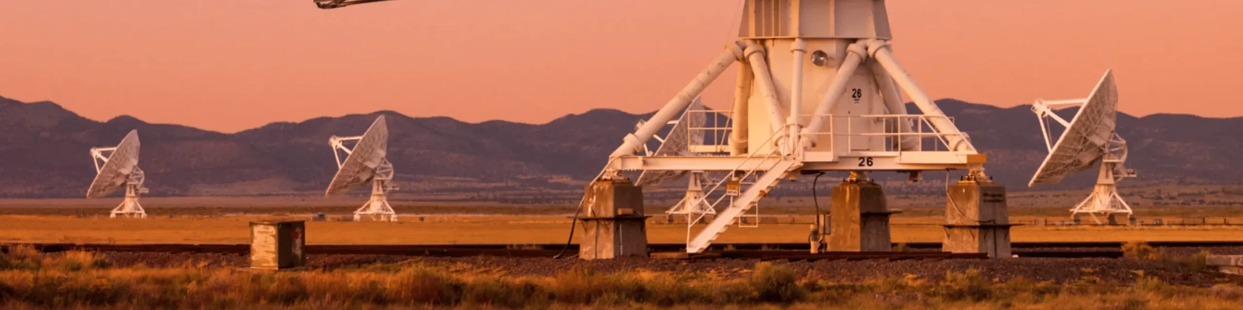 A number of satellites in a pink sky