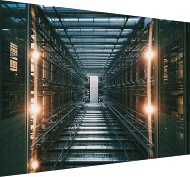 Vertical shot of an illuminated data center storage and network server room