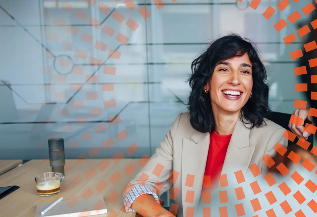 Smiling Woman in Business Meeting Engaging With Colleague at Office Table