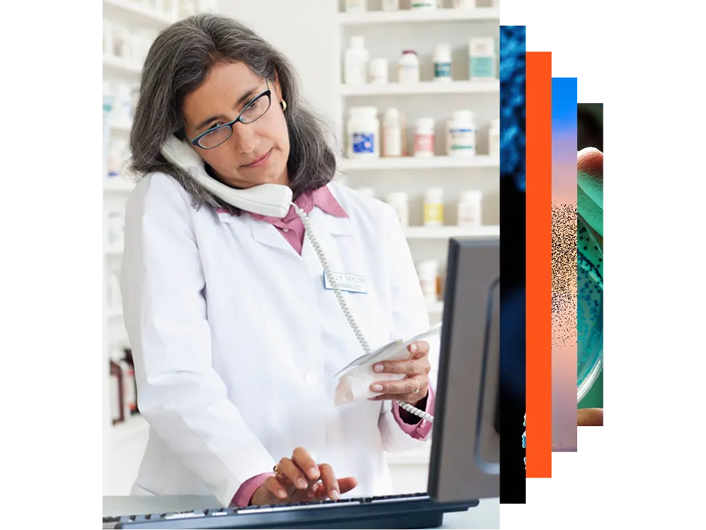 Pharmacist using a computer in a pharmacy