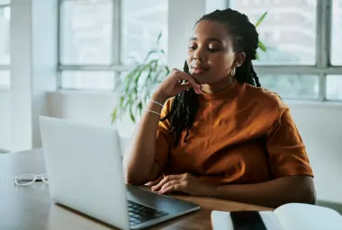 a young black business woman working on her laptop computer